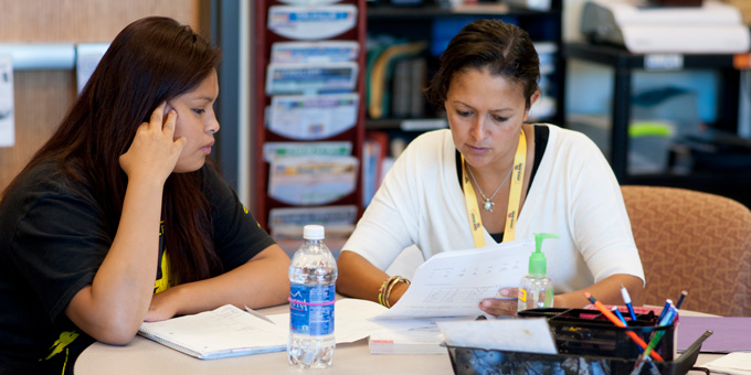 Faculty helping student.